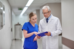 Nurse showing doctor chart