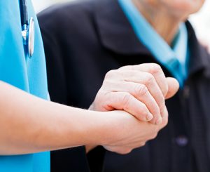 Female doctor comforts male