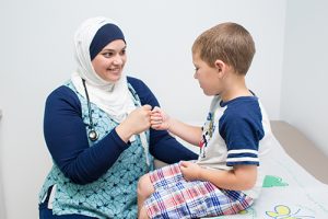 Dr. Ameera Nauman sees a pediatric patient