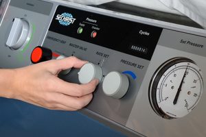 Medical office assistant Brandee Thrasher adjusts the settings on a hyperbaric oxygen chamber for a patient at the OSF Wound Care Clinic.