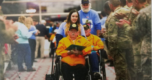 Hospice Nurse pushing Richmon Purl in a wheelchair