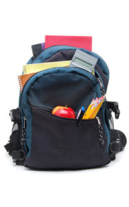 child's backpack loaded with school supplies