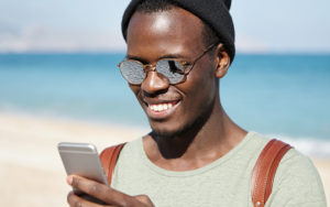 man taking a selfie on a beach