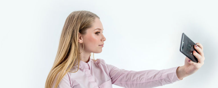 young woman taking a selfie