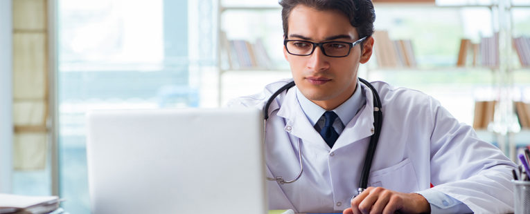 physician helping a patient remotely using a computer
