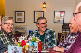 Craig Stewart and friends at a dinner table