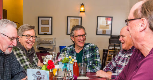 Craig Stewart and friends at a dinner table
