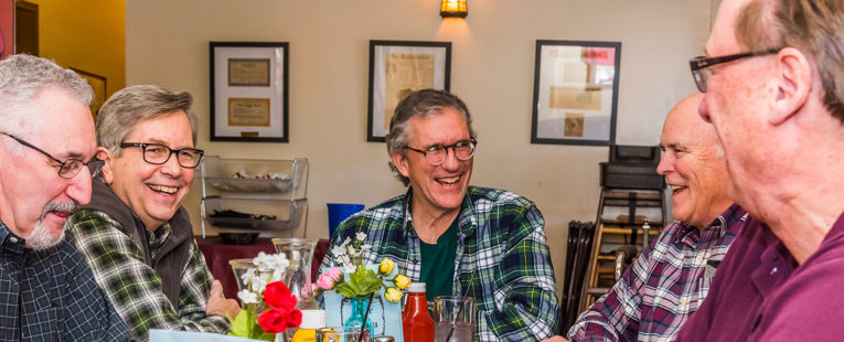 Craig Stewart and friends at a dinner table
