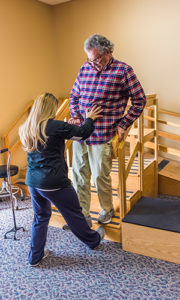 Craig Stewart in physical therapy session with stroke specialist