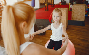 Mother and daughter working out together