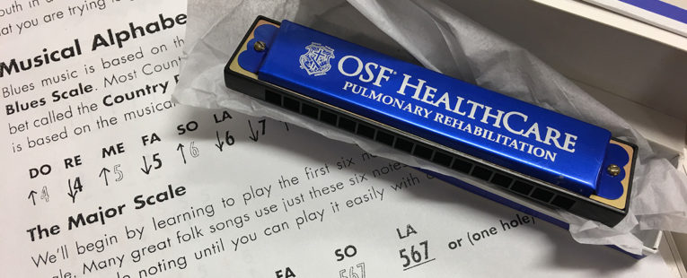 OSF HealthCare harmonica therapy instrument and sheet music