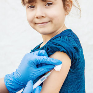 Young girl getting a measles vaccine
