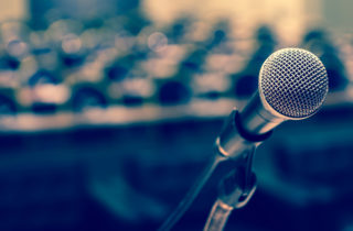 microphone at a podium in an empty hall