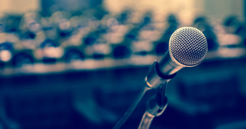 microphone at a podium in an empty hall