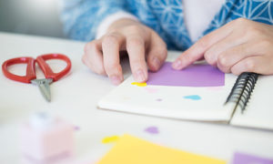 patient assembling a scrapbook