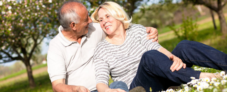 senior couple in a field