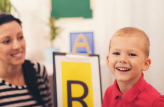 boy with autism in an developmental specialist's office.