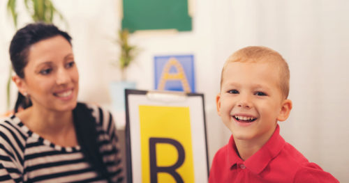 boy with autism in an developmental specialist's office.