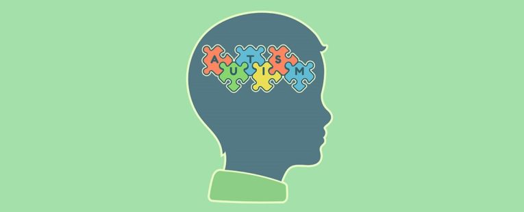 child's silhouette with autism spelled out in cartoonpuzzle pieces