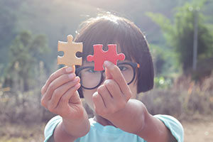 young file with puzzle pieces
