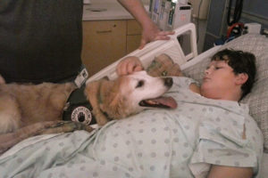 Kaleb Reedy with service dog, Dory