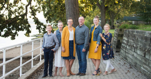 Leann Stickel outdoors with husband and family