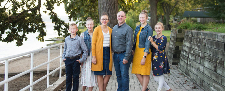 Leann Stickel outdoors with husband and family