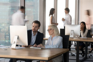 Female and male colleague preparing for change