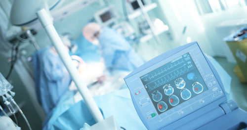 physicians treating a stroke patient in a hospital operating room