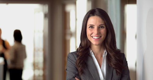 executive leader smiling in office lobby