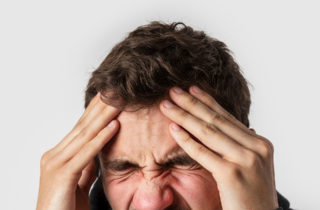 man suffering from aneurysm