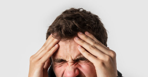 man suffering from aneurysm