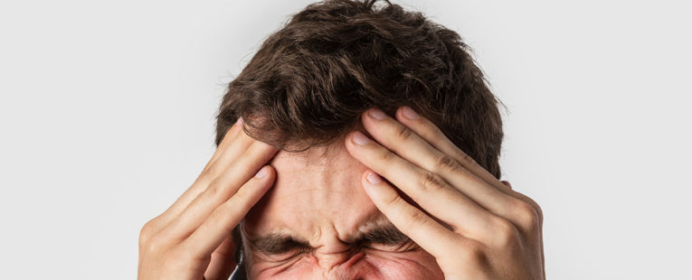 man suffering from aneurysm