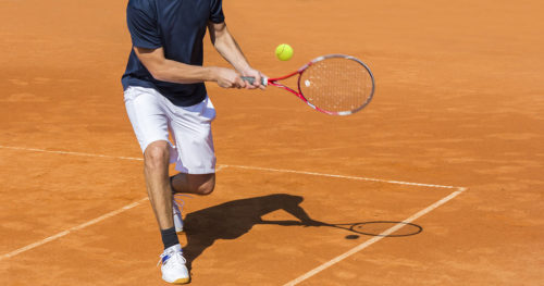 young athlete playing tennis