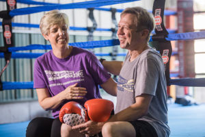 woman and man outside boxing ring