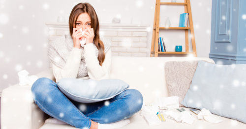 Young woman with allergies in her living room