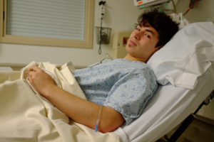 teen male in a hospital bed