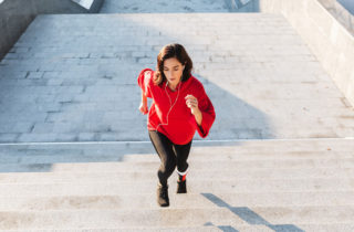 woman excersising by climbing stairs