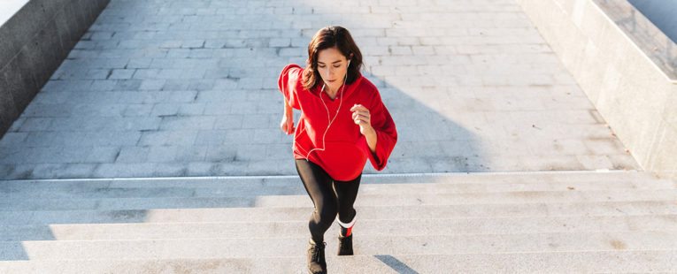 woman excersising by climbing stairs