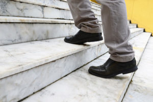 man climbing stairs at work