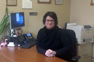 Cherie Reynolds with OSF HealthCare Foundation at work in her office