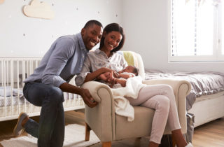 African-American couple with infant son in need of pediatrician