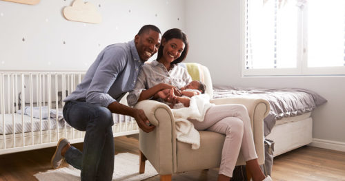 African-American couple with infant son in need of pediatrician