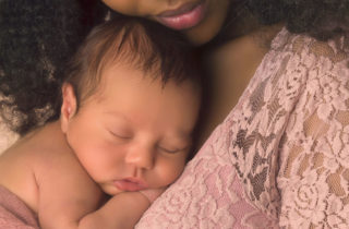 Baby sleeping on mother's chest