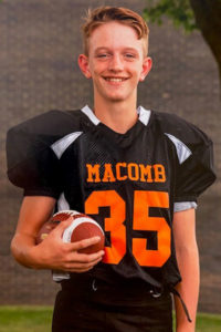 adolescent boy with asthma in football uniform