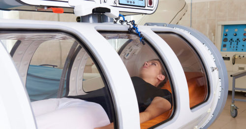 female patient in hyperbaric oxygen therapy chamber