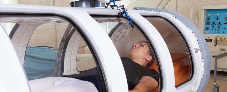 female patient in hyperbaric oxygen therapy chamber