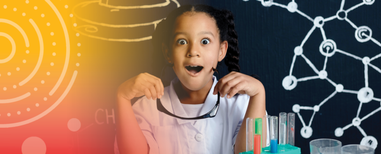 Young girl in lab coat doing STEAM excercises