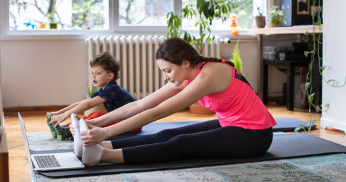 Woman and Child Exercise at Home