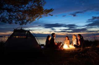People gathering around a campfire.